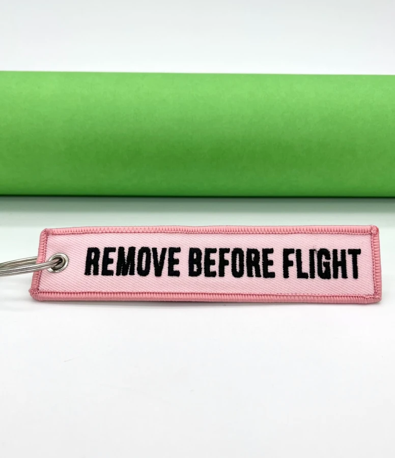 Remove Before Flight pink Keychain