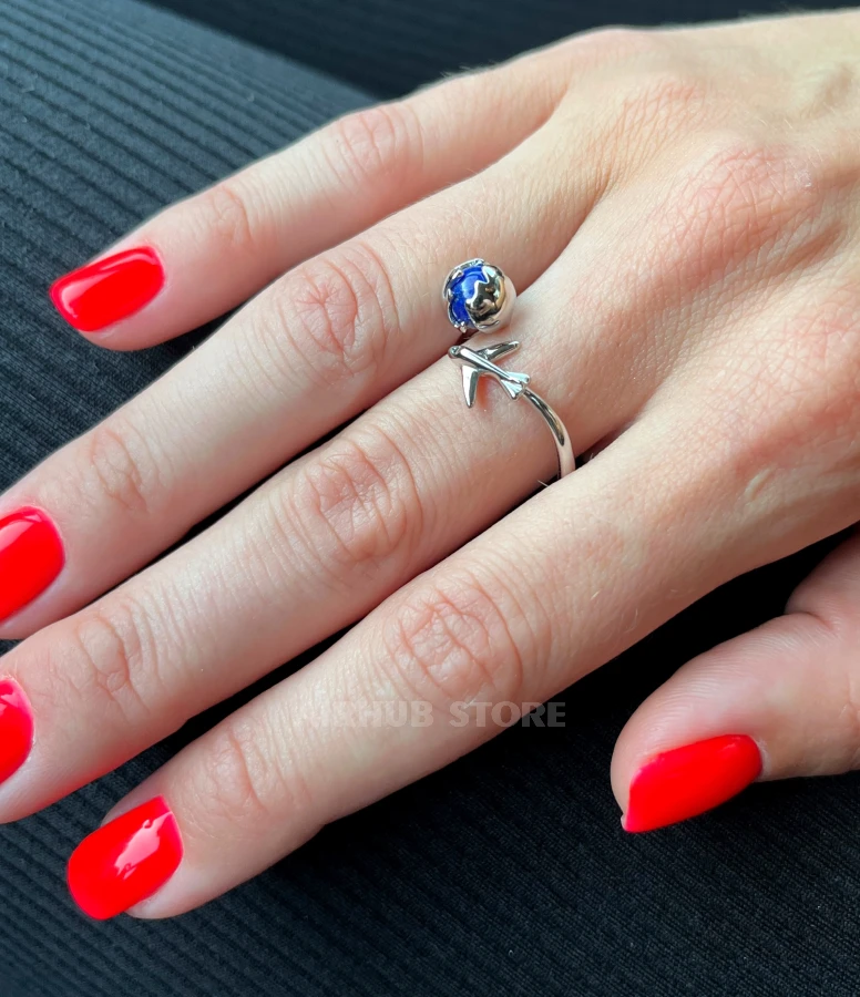 Airplane with blue planet Ring