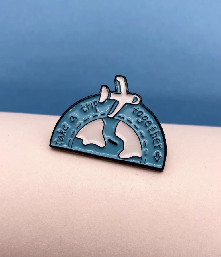 Pin with an airplane Take a trip together