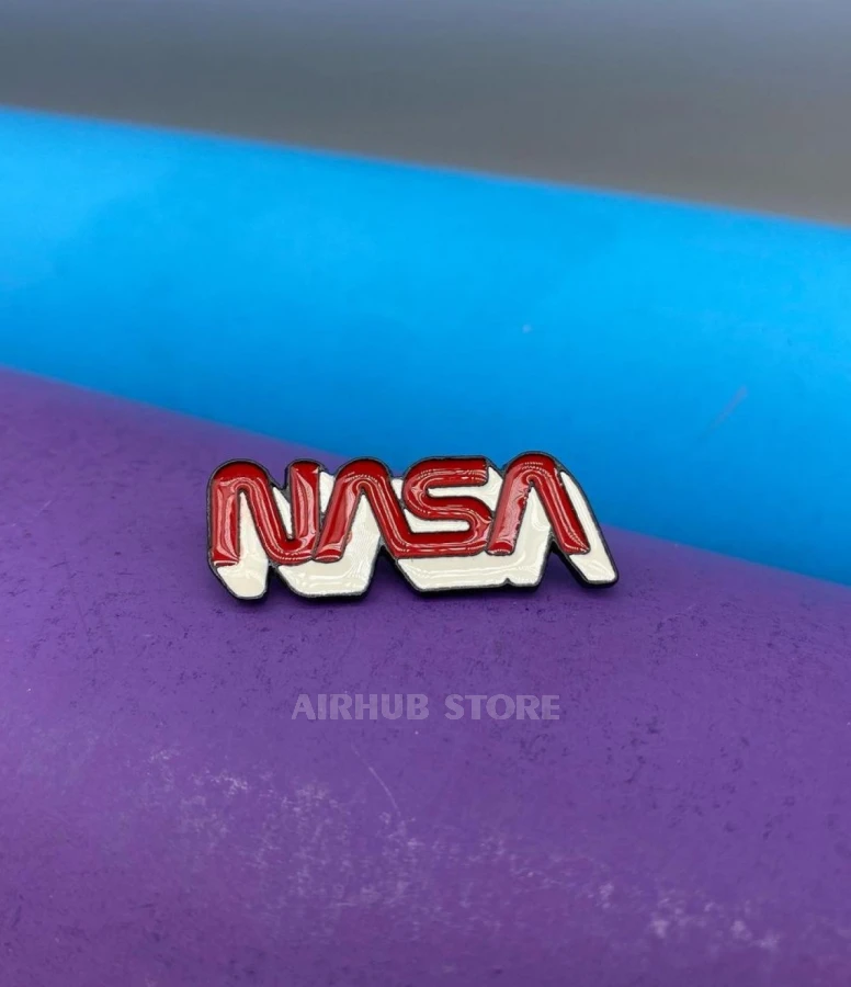 Pin NASA inscription