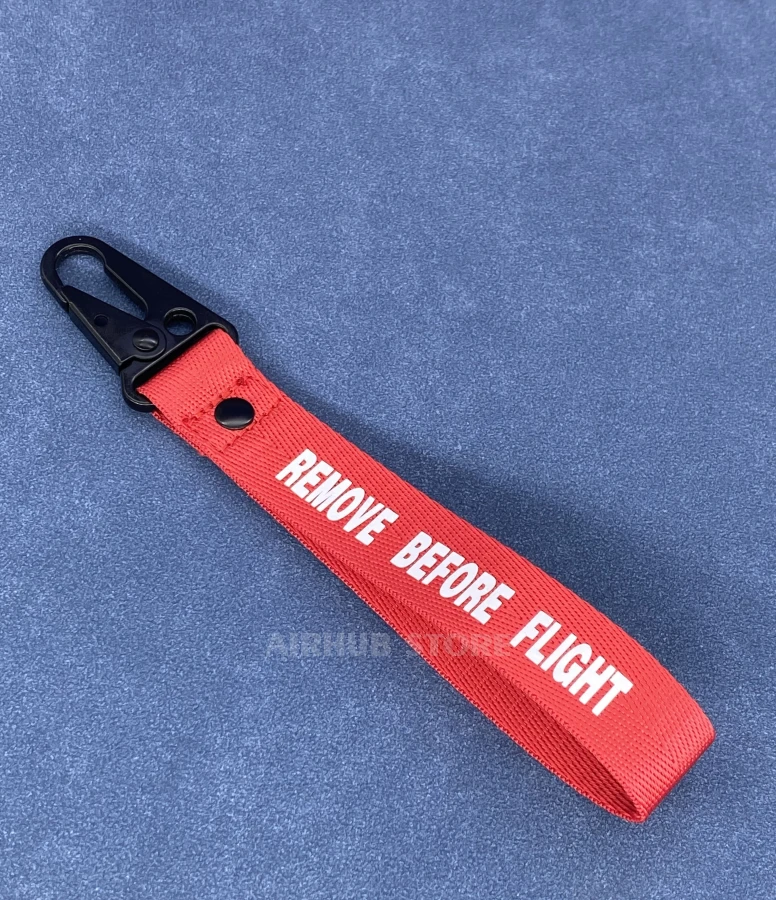 Remove Before Flight Keychain with a Black Carabiner