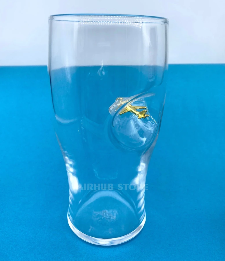 Beer glass with an airplane