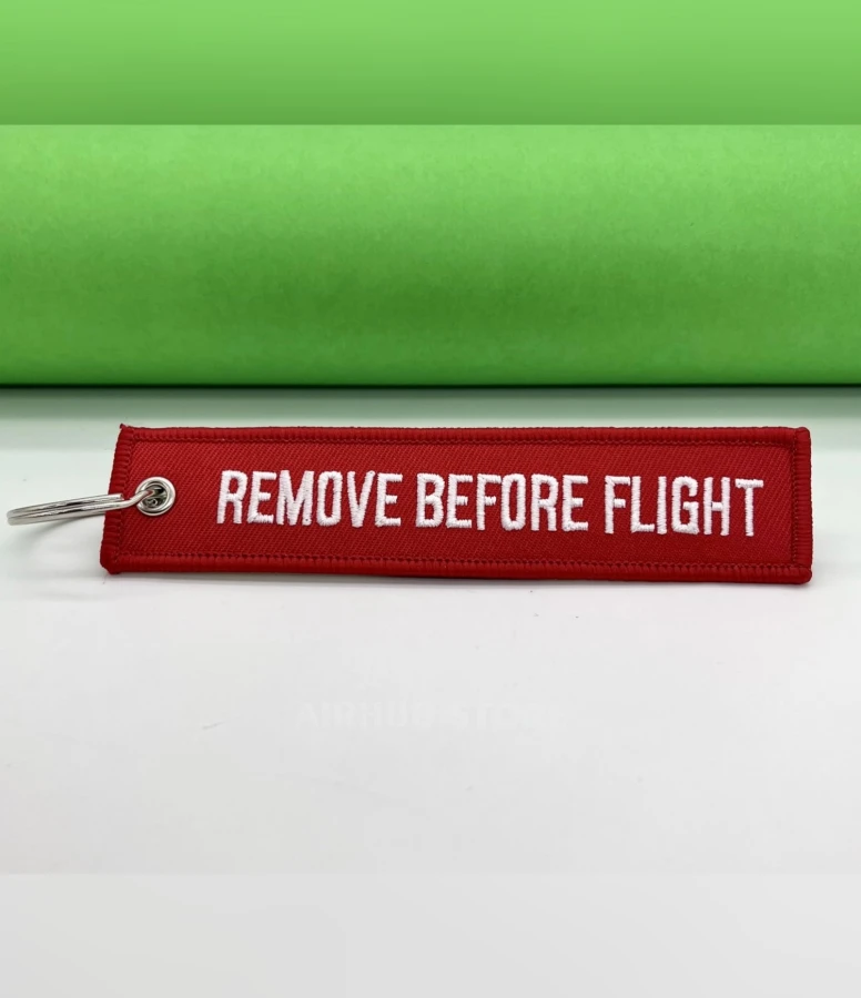 Remove Before Flight red Keychain