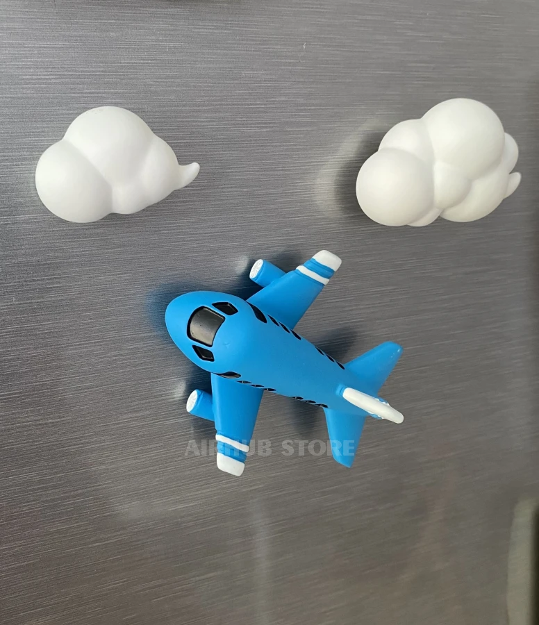 Magnet blue airplane and clouds